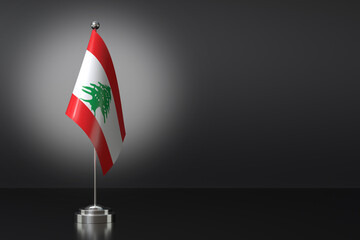 Naklejka premium Small Republic of Lebanon Flag in Front of Black Background, 3d Rendering