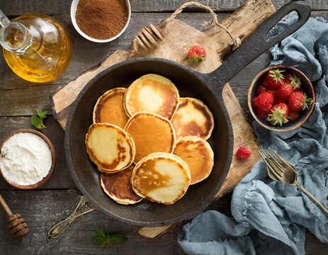 Generated image of pancakes on a pan, view from above