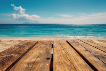 A wooden table set against the backdrop of the sea, an island, and the blue sky