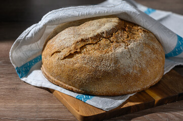homemade whole grain bread in the kitchen on a wooden table 1