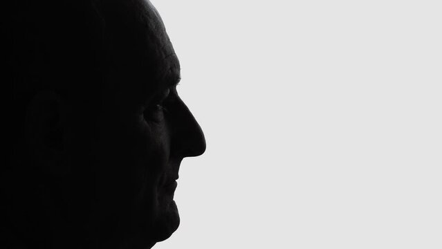 Profile silhouette of old man head, isolated on white