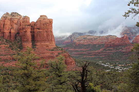 Beautiful views of the landscape of Sedona, Arizona in winter, with Sedona surrounded by red-rock buttes, steep canyon walls and pine forests
