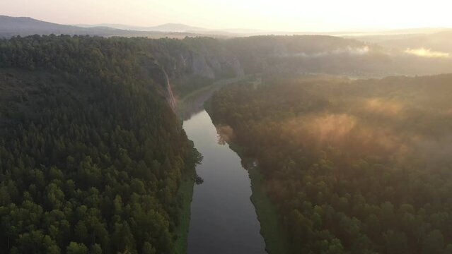 Tranquil scene of river with morning haze. Famous Agidel river in Burzyan region of Bashkortostan