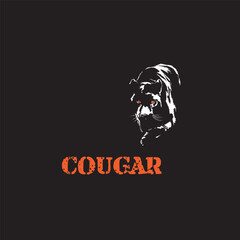 crouching cougar on a black background