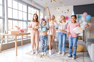 Cute little children with confetti celebrating Birthday at home - Powered by Adobe
