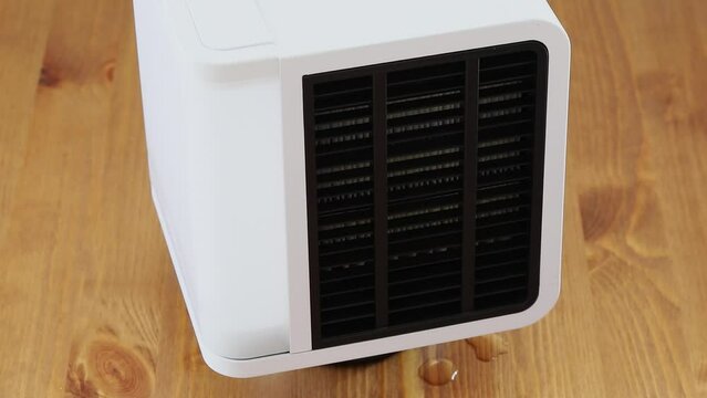 Water drops fall from air humidifier which rotates