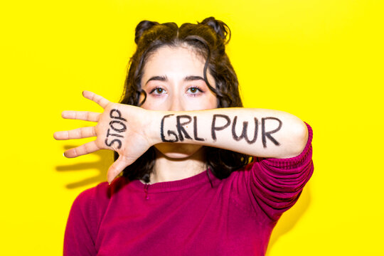 Empowering "GRL PWR" Message on Woman's Forearm
