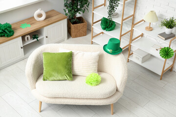 Fototapeta na wymiar Interior of light living room with white sofa and decorations for St. Patrick's Day celebration