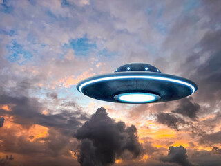 UFO. Alien spaceship among clouds in sky. Extraterrestrial visitors