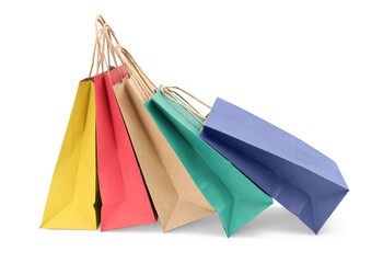 Colorful and kraft paper shopping bags isolated on white