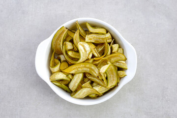 Banana chips, fried slices banana with green peel