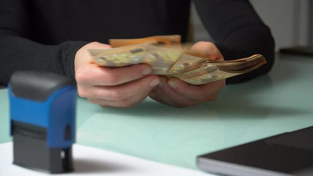 4K close up footage of female hands counting 50 euro  banknotes.