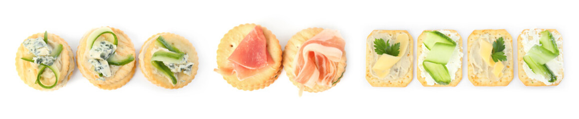 Delicious crackers with different toppings isolated on white, top view