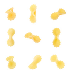 Naklejka premium Raw farfalline pasta isolated on white, set