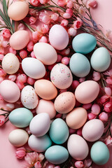Easter eggs and spring flowers on pink paper background. Easter composition. Space for text. Top view