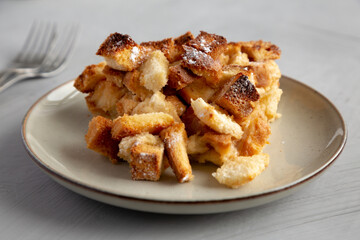 Homemade Bread Pudding on a Plate, side view. Close-up.