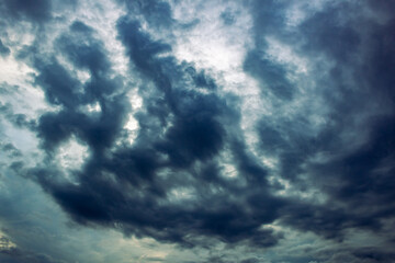 Naklejka na ściany i meble big clouds in dramatic sky before storm