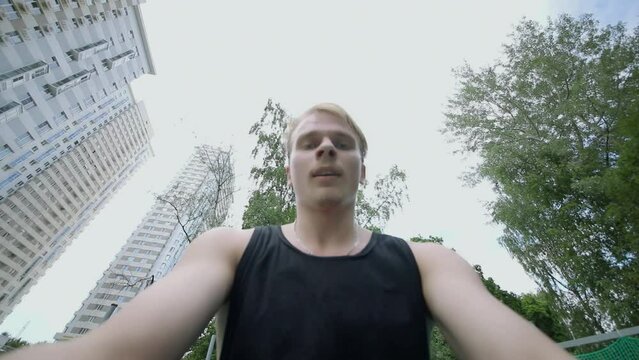 Face of man during jumping on trampoline. Slow motion