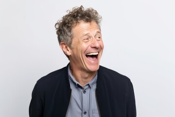 Portrait of a happy mature man laughing and looking at the camera