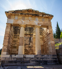 Athenian Treasury in Delphi, an archaeological site in Greece. Delphi is greek religious sanctuaries to the god Apollo.. UNESCO World heritage.