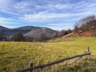 Fototapeta premium meadow and field in a mountain valley