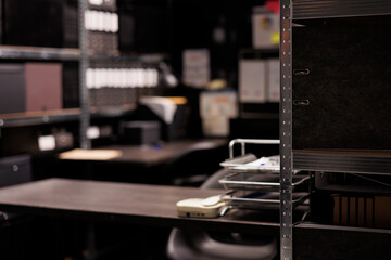 Selective focus of metallic storage full with confidential federal documents. Empty arhive room in...