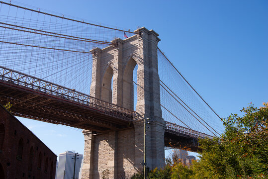 Brooklyn bridge against blue sky