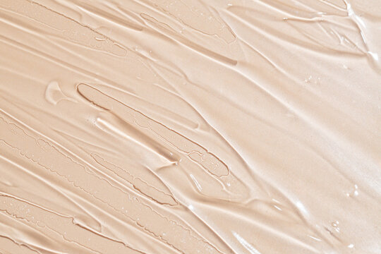 Close-up texture of creamy beige foundation