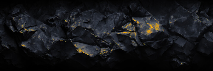 Panoramic black stone background banner design. Dark gold rock grunge texture. Mountain surface close-up cracked empty copy space