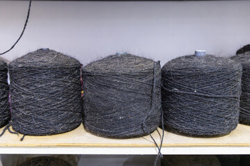 Spools of heavy wool trhead at a tent maker's shop.