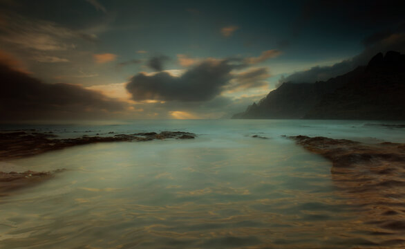 Tranquil sunset over serene coastal waters in Tenerife Island
