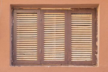 Wooden shuttered window in old town Al-Ula.