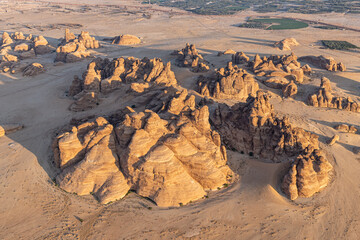 Rock formations in the Saudi Arabian desert, seen from a hot air balloon.