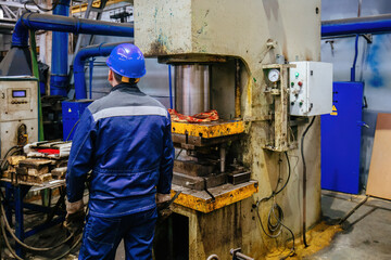 Operator working with hydraulic press