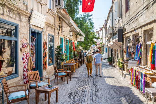 Couple walking down a narrow street