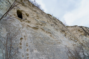 Monk's cave in the rock. Background with selective focus and copy space