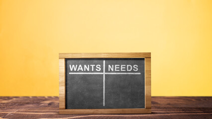 Wants and needs table list on the chalkboard © Leo Lintang