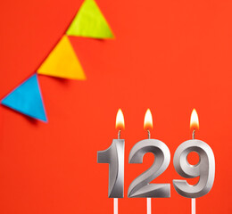 Birthday card - Number 129 candle in orange background