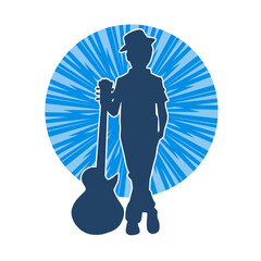Silhouette of a young kid in pose with an acoustic guitar. Silhouette of a young musician in pose with acoustic guitar musical instrument.