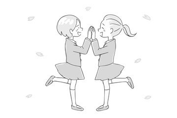 喜び合う学生の女の子たちと桜の花びら