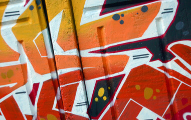 Colorful background of graffiti painting artwork with bright aerosol outlines on wall. Old school...
