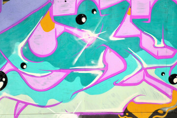 Colorful background of graffiti painting artwork with bright aerosol outlines on wall. Old school...