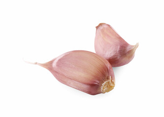 Unpeeled cloves of garlic isolated on white