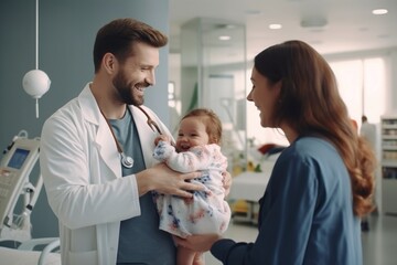 Doctor happily interacting with a baby and mother in a hospital