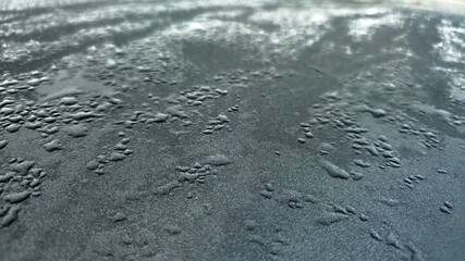 Water droplets clinging around the car