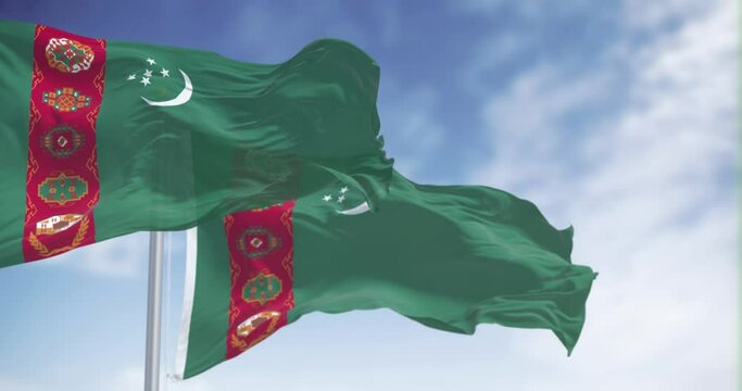 Turkmenistan national flags waving on a clear day