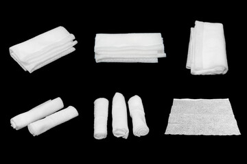 Wet tissues folded in various shapes, black background.