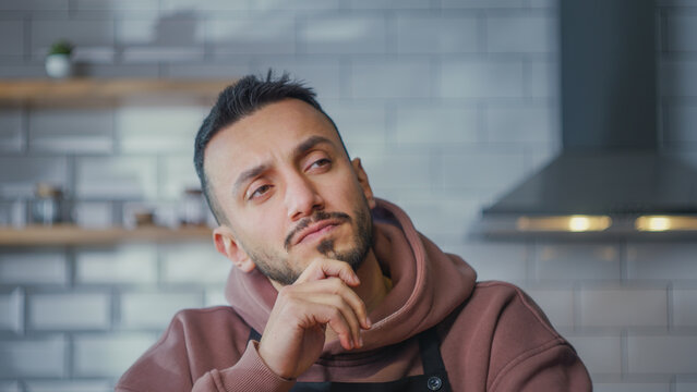 Pensive man thinking idea and find solution. Male ponder deep in thoughts dreaming searching solution, difficult creative thoughtful pondering at kitchen