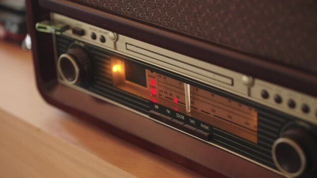 Old radio with station changer. The nostalgia of a rare piece used by enthusiasts and collectors. The player is often found in villages and cottages