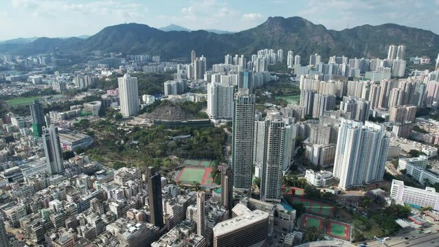 Aerial drone skyview of residential community in Wong Tai Sin Lok Fu Wang Tau Hom San Po Kong Kowloon City Kai Tak Sung Wong Toi near Lion Rock mountain Hong Kong
